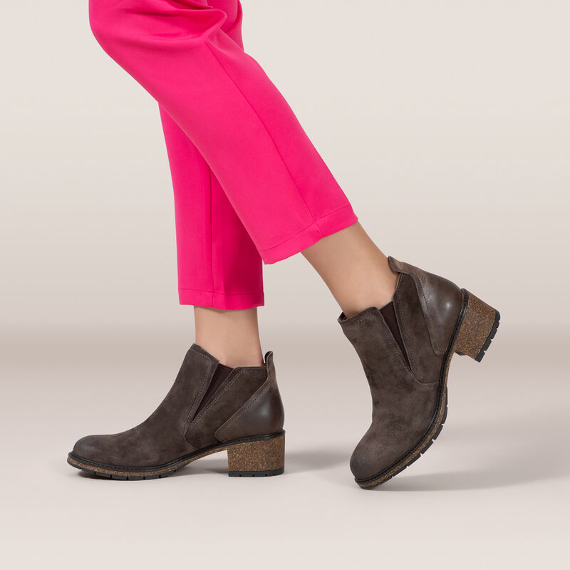 brown slip-on boot on feet 